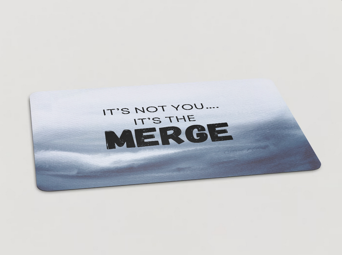Magnet with "It's Not You...It's the Merge" written in black text on a multicolored background