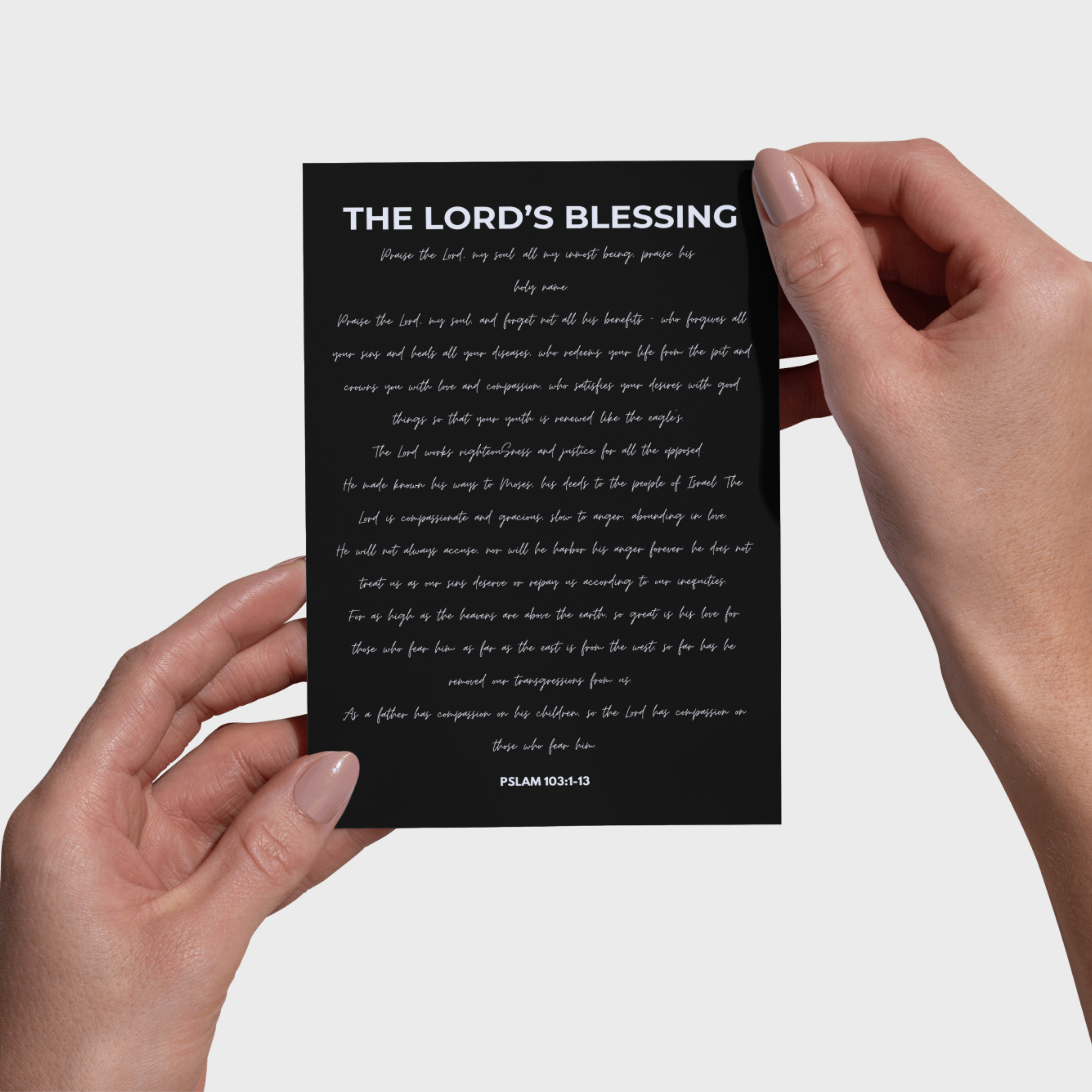 Black 5x7 print with 'The Lord's Blessing' text held by hands against a light gray background