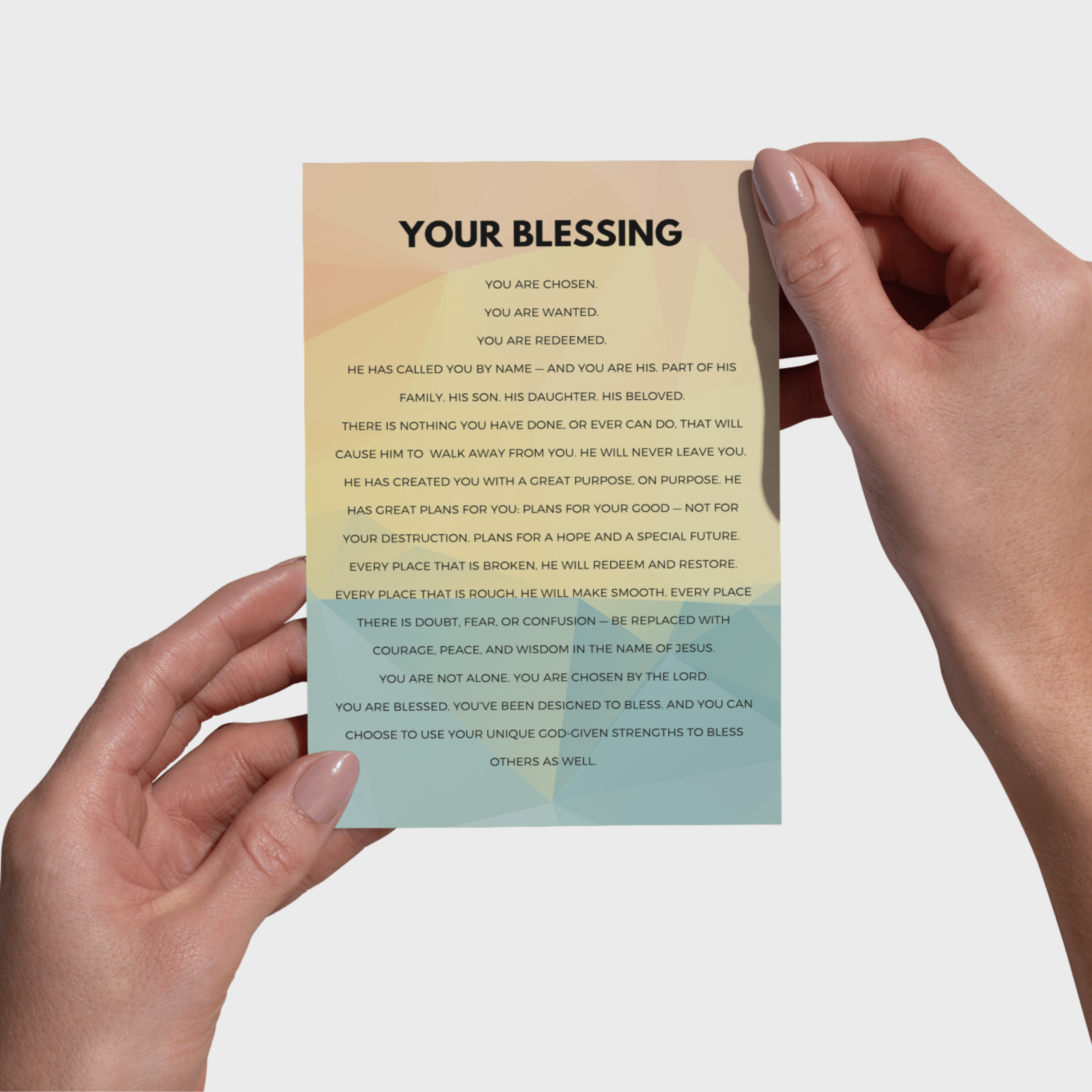 Hands holding a 5x7 print with 'Your Blessing' message on a gradient background