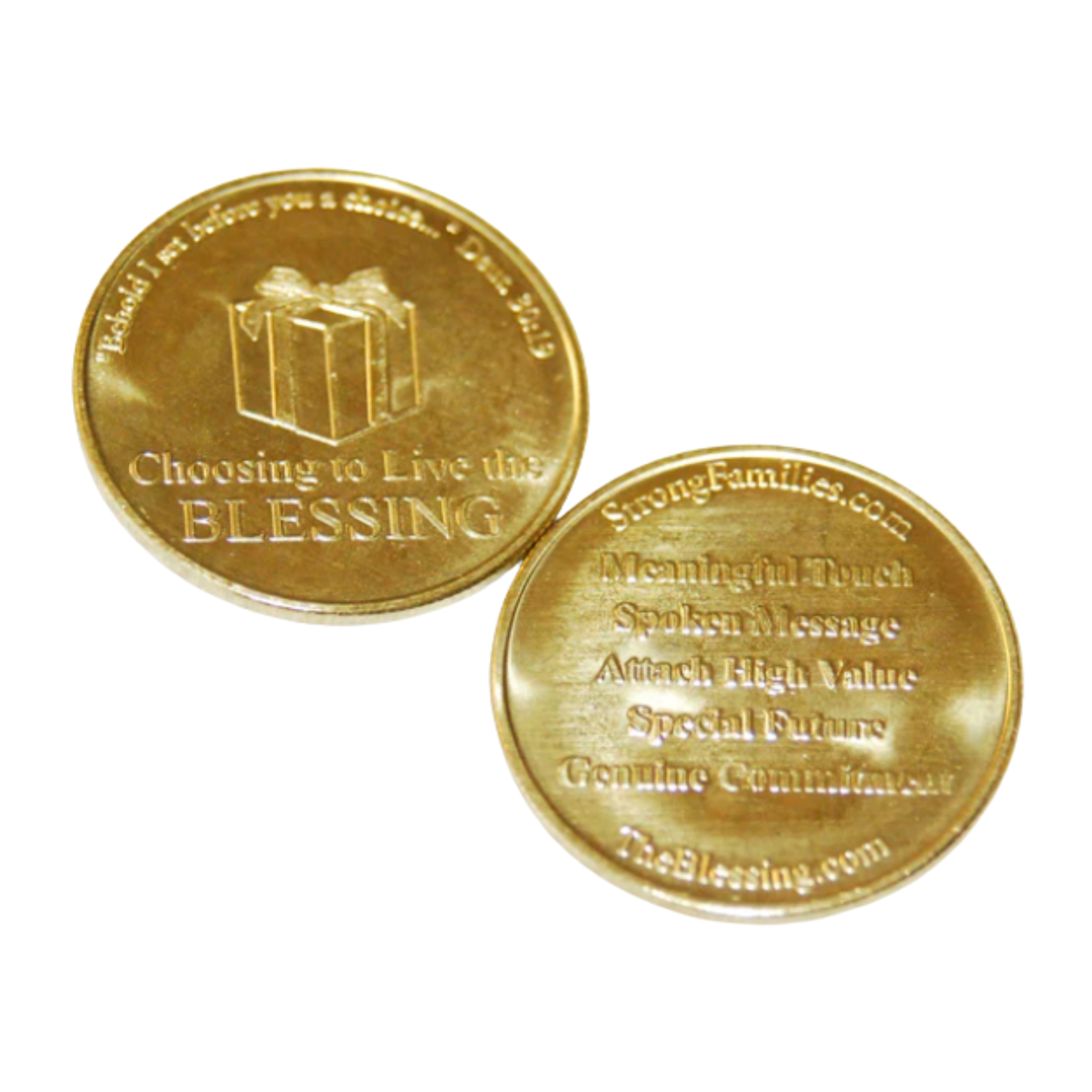 Front and back view of a Blessing Coin, gold-colored coin with inscriptions. One coin displays the words 'Choosing to Live the Blessing' and the other has the five elements of the blessing engraved on it.