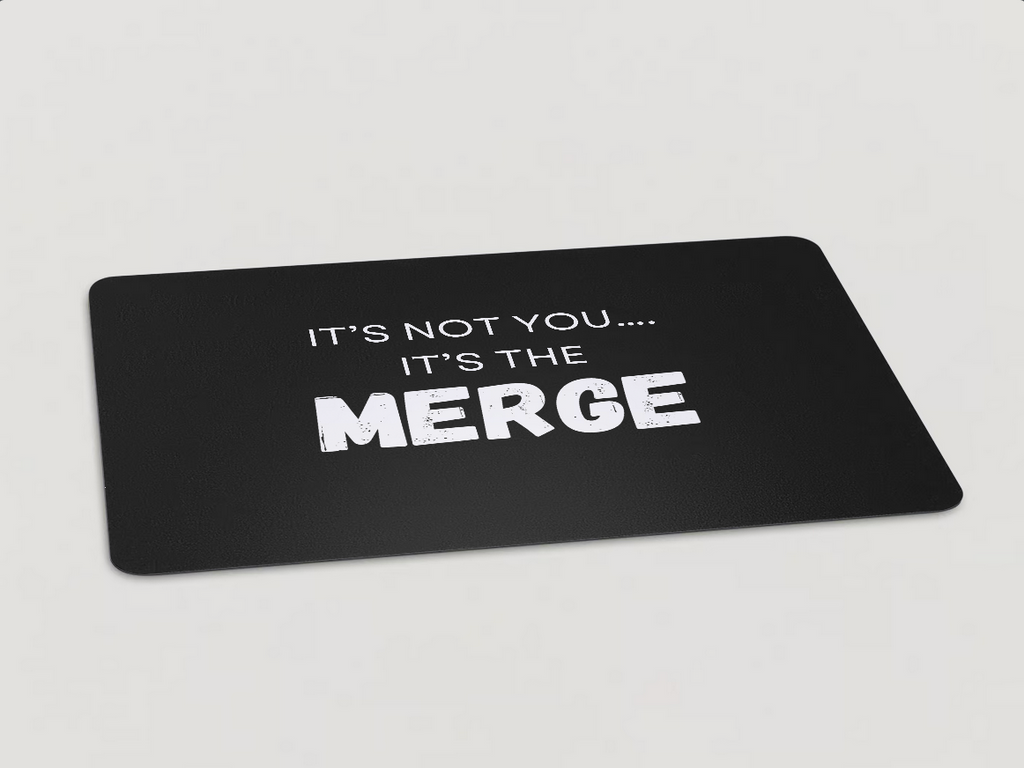 Magnet with "It's Not You...It's the Merge" written in white text on a black background